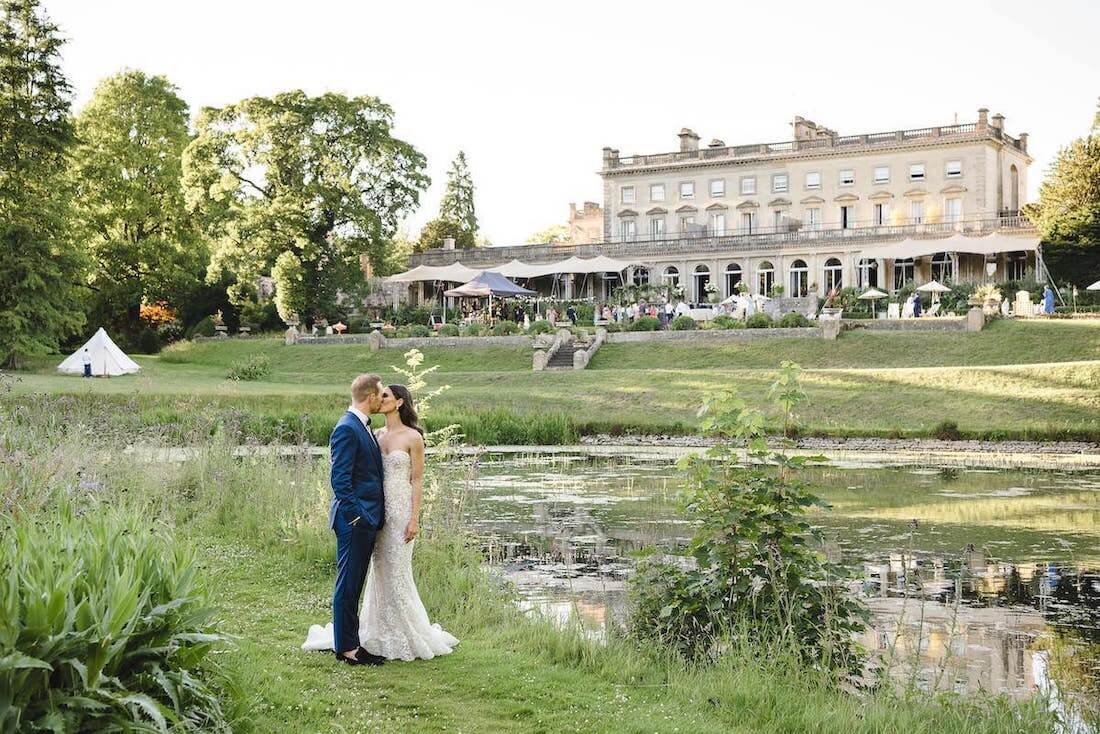 the gardens, lake and house at Cowley Manor