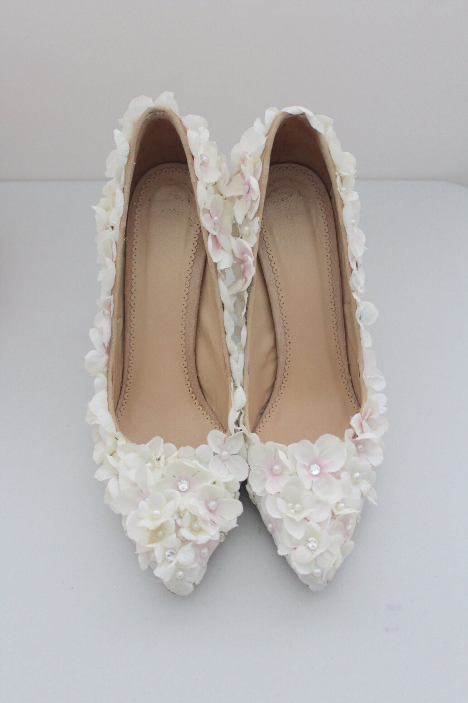 Ivory. floral covered shoes with pearls