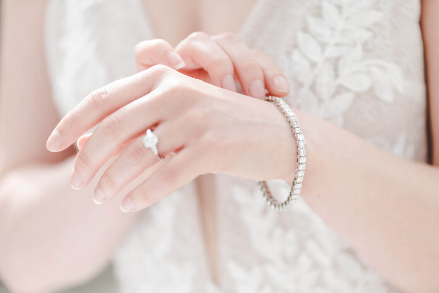 brides hands showing rings and bracelet