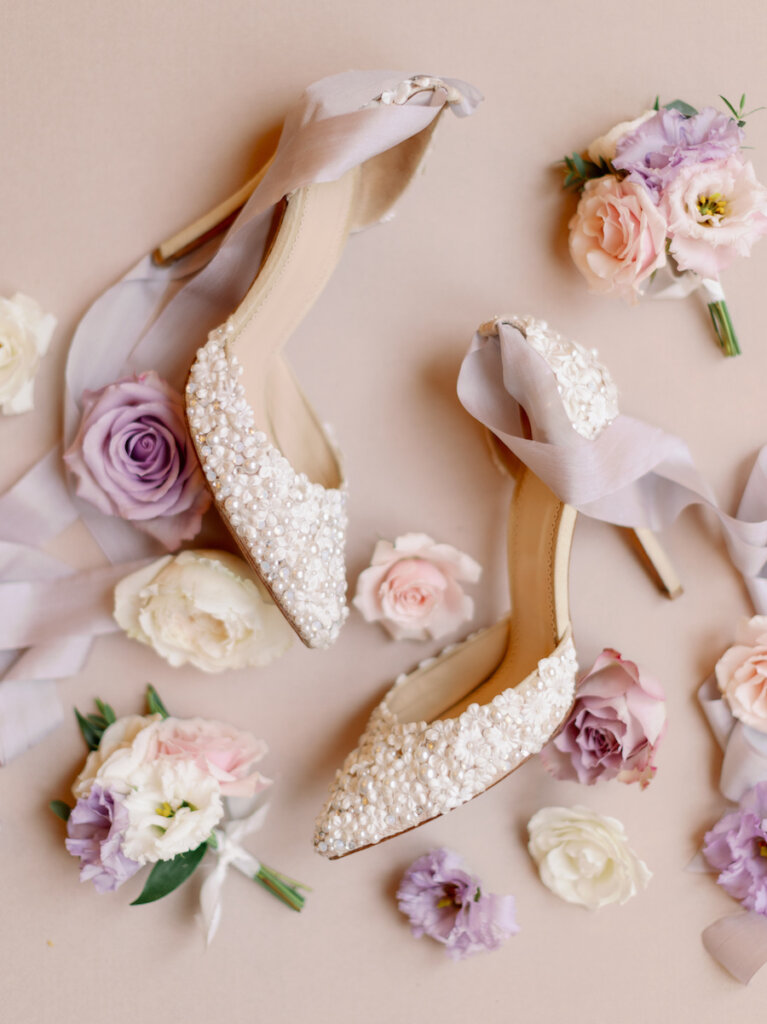 pearl wedding shoes and. flowers