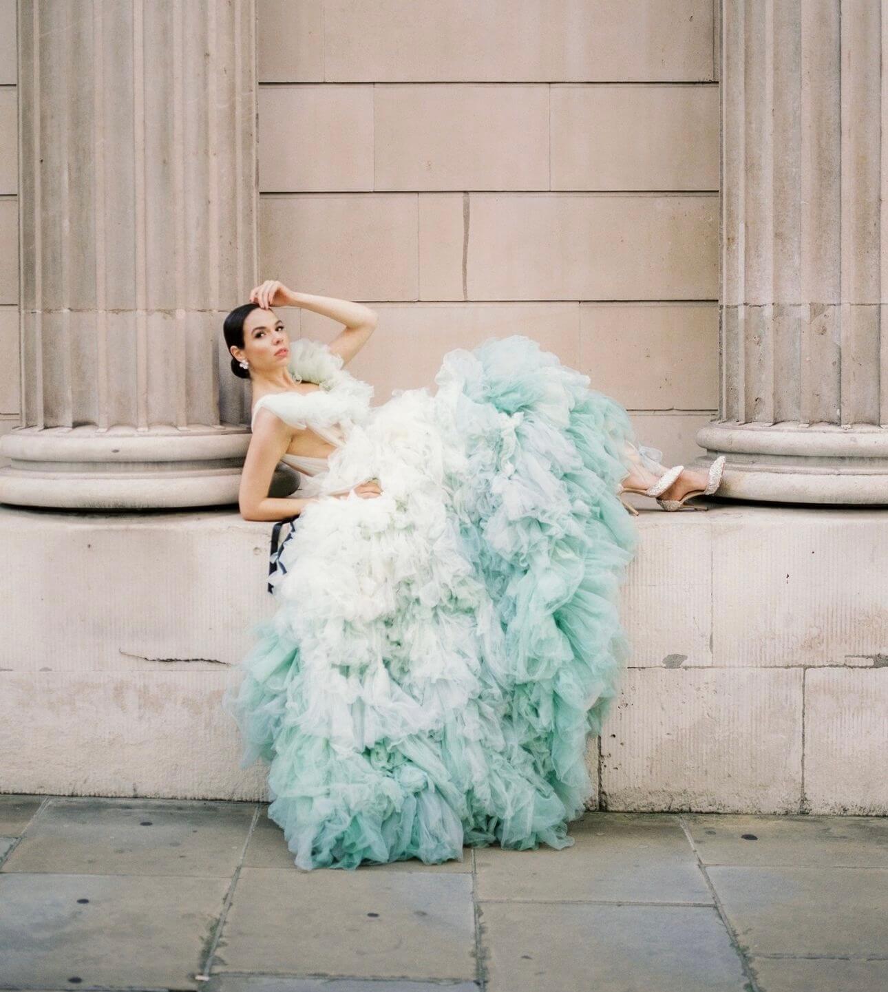 pastel blue ruffle wedding gown paired with Di Hassall shoes